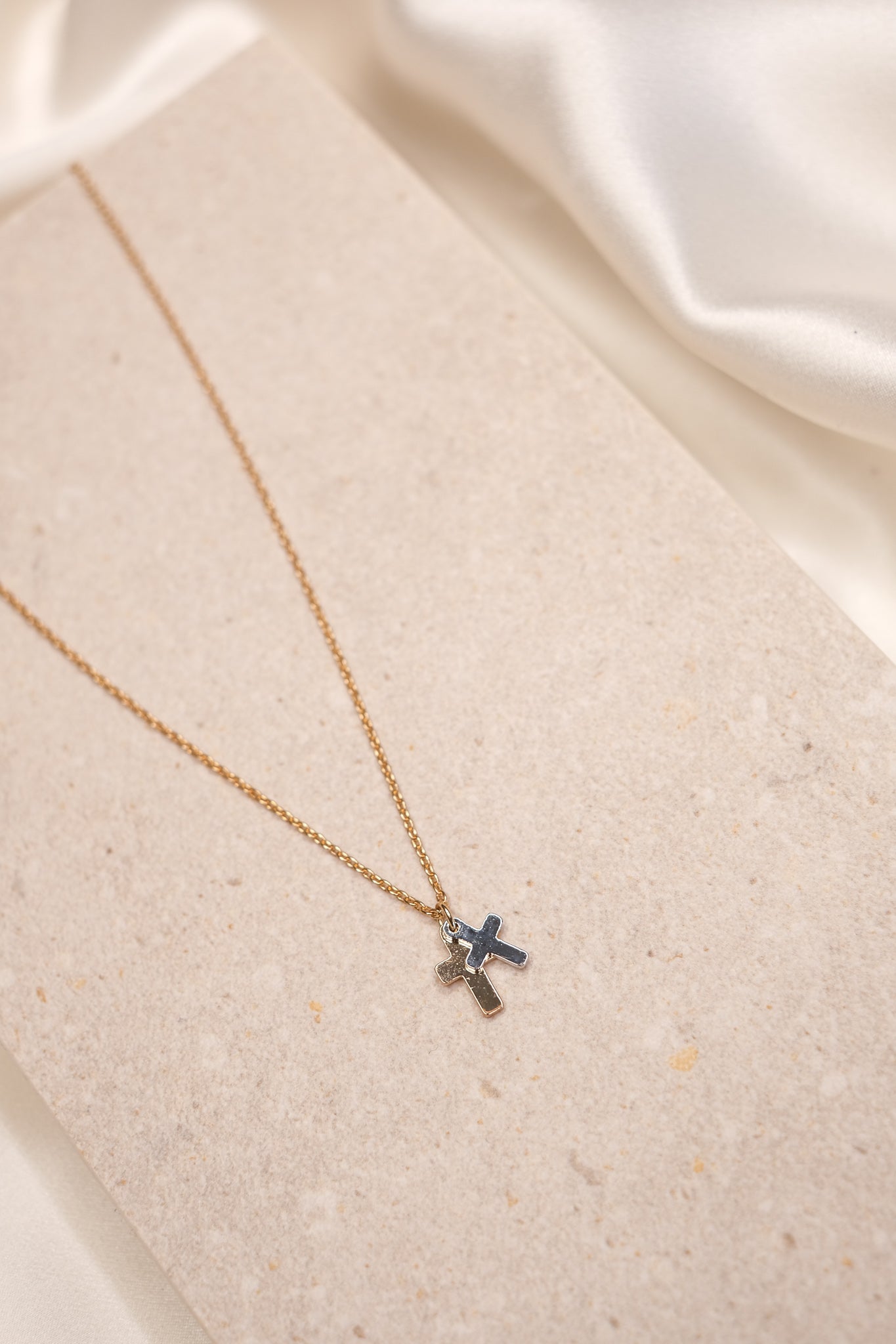 gold and silver cross necklace
