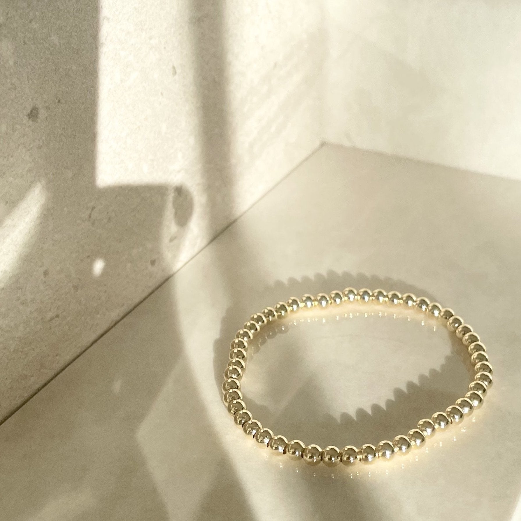 gold plated ball bracelets - gold beaded bracelets - gold beaded ball bracelet that gives back to charity